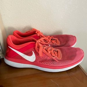 Orange and pink running shoe- Nike